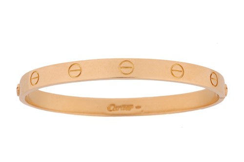 Lot 199 - Cartier - a 'LOVE' bangle, composed of two...