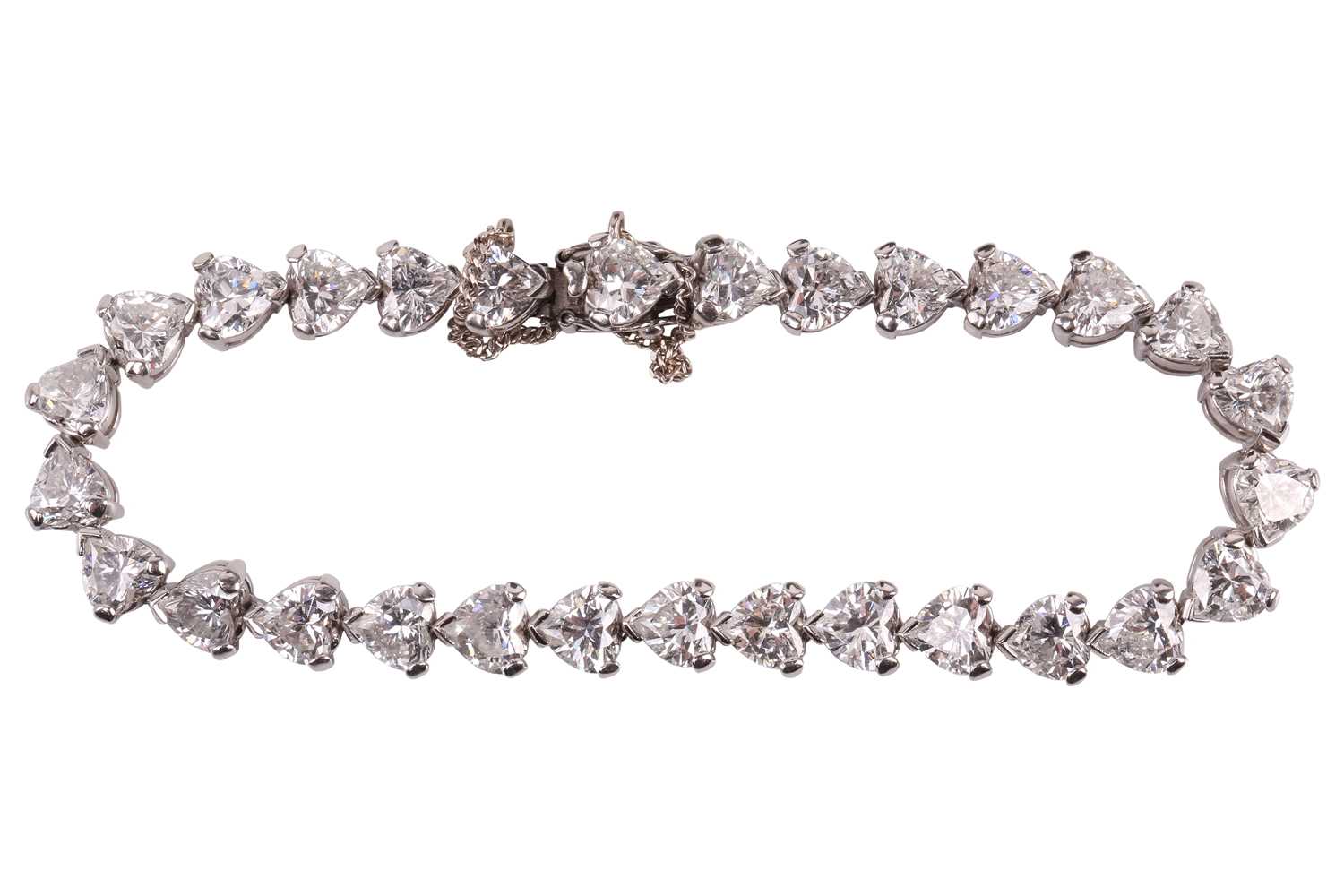 Lot 201 - A diamond tennis bracelet in platinum, set...