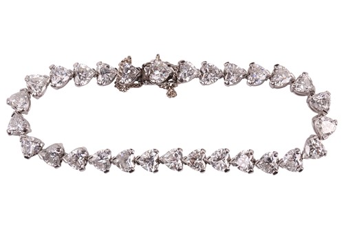 Lot 201 - A diamond tennis bracelet in platinum, set...