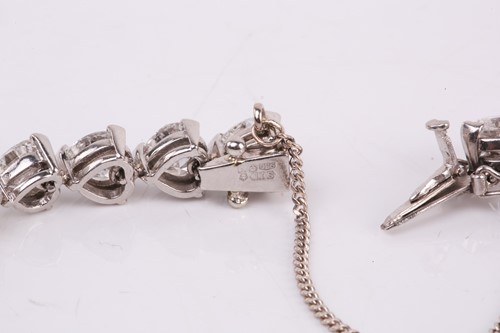 Lot 201 - A diamond tennis bracelet in platinum, set...