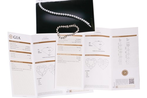Lot 201 - A diamond tennis bracelet in platinum, set...