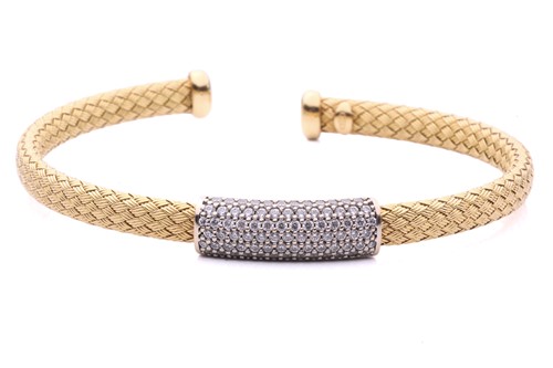 Lot 16 - A wire mesh bangle featuring a central panel...