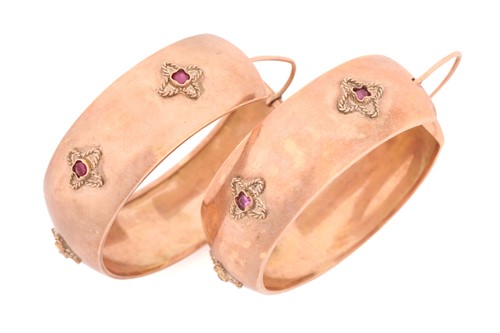 Lot 58 - A pair of large hoop earrings set with rubies...