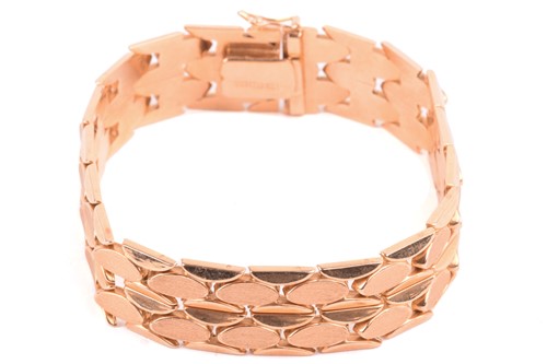 Lot 173 - A fancy link bracelet of ovoid design, with...