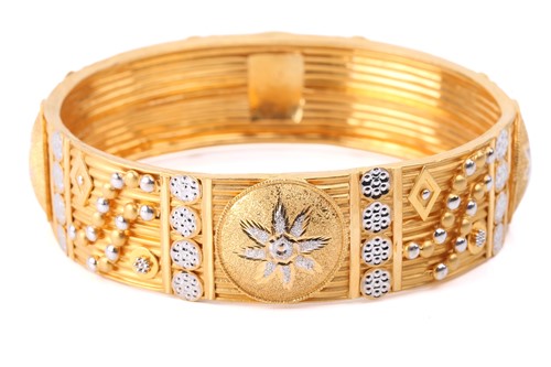 Lot 187 - An Indian closed bangle, of geometrical design,...