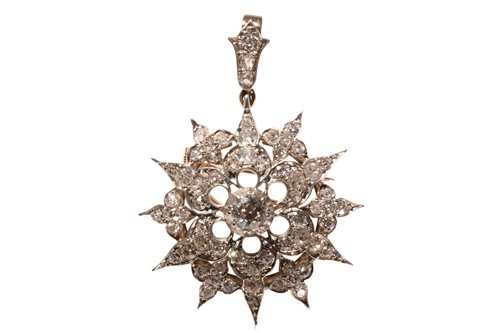 Lot 36 - A Victorian style diamond star brooch/pendant,...