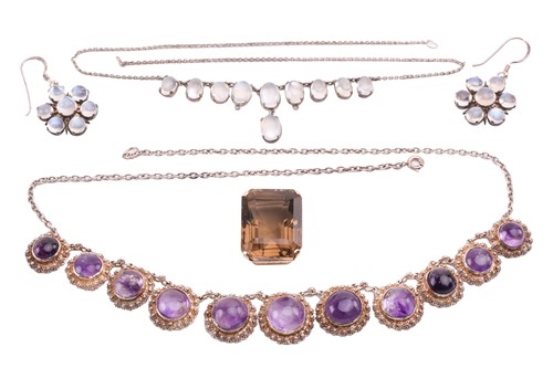 Lot 44 - A smokey quartz pendant, the emerald cut...