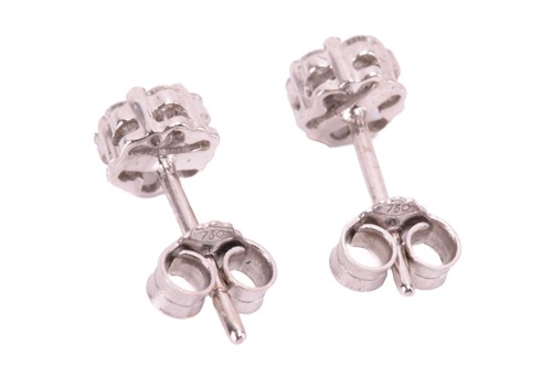 Lot 125 - A diamond ring and earrings; the ring in a...