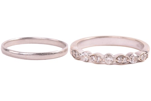 Lot 18 - A diamond half hoop eternity ring set with...