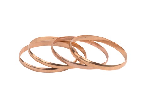 Lot 109 - Four yellow metal closed bangles, all with...