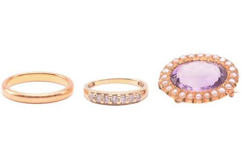 Lot 268 - An amethyst and seed pearl brooch, the central...