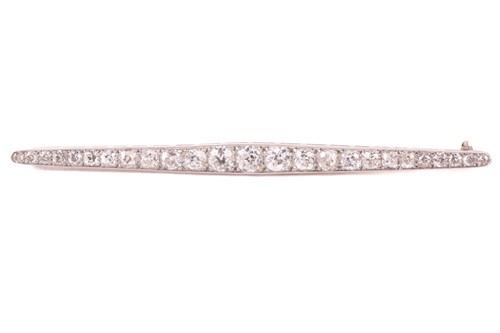 Lot 274 - A diamond bar brooch, circa 1930, designed as...