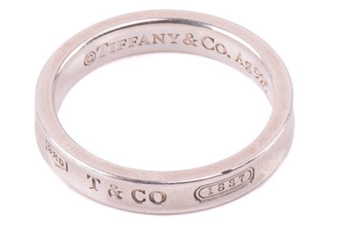 Lot 148 - Tiffany & Co. - a narrow 1837 ring, with...