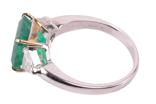 Lot 6 - A vivid emerald and diamond three-stone ring,...