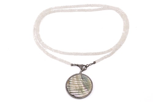 Lot 49 - A diamond and mother of pearl pendant, the...