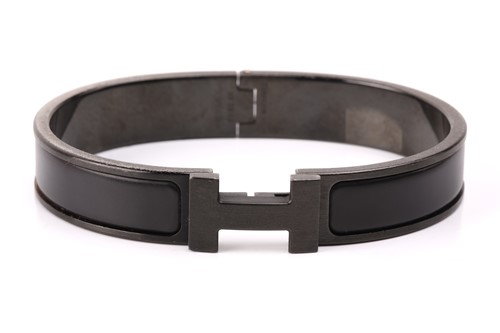 Lot 29 - Hermès - a narrow 'Clic HH So Black' bracelet...