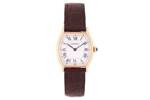 Lot 400 - Cartier. An 18 carat gold Tortue watch. The...