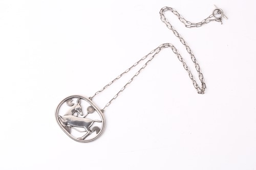 Lot 286 - Georg Jensen - a necklace with kneeling fawn...