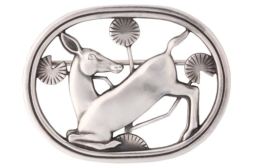 Lot 284 - Georg Jensen - A brooch depicting kneeling...