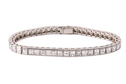 Lot 278 - A diamond line bracelet, incorporating...