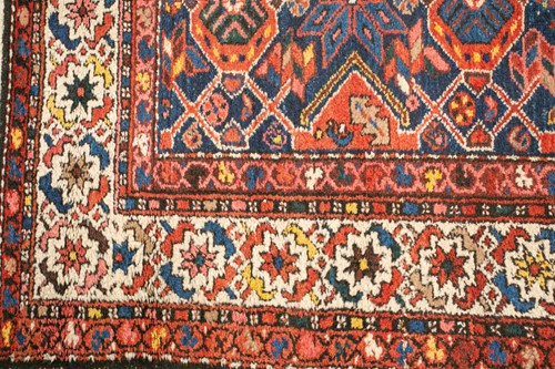 Lot 152 - • An antique Hammadan/Malayer runner with a...