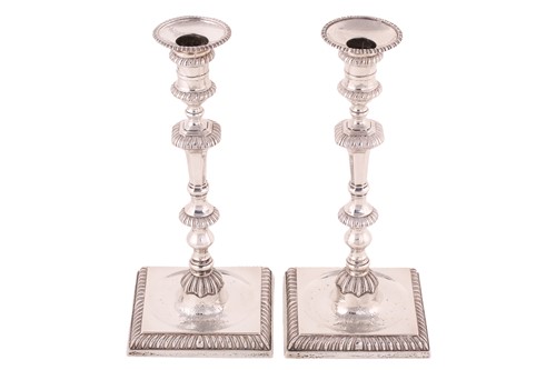 Lot 534 - A pair of George III silver candlesticks,...