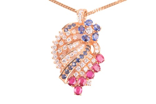 Lot 25 - A diamond, ruby and sapphire spray pendant on...