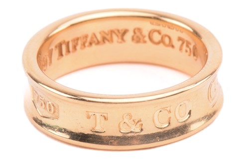 Lot 15 - Tiffany & Co. - an 18ct yellow gold ring from...