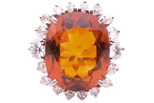 Lot 85 - A citrine and diamond ring, set with a central...