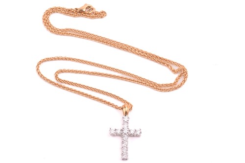 Lot 5 - A diamond cross pendant, set with round...