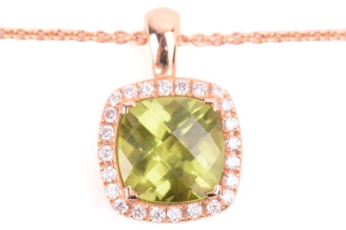 Lot 225 - A peridot and diamond cluster pendant in 18ct...