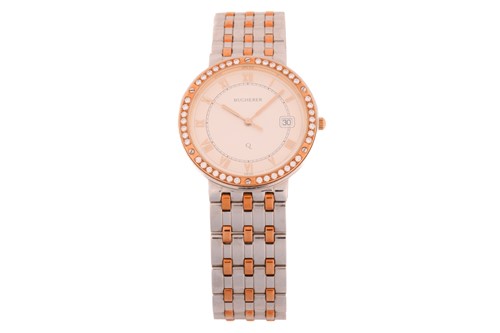 Lot 404 - A Bucherer Jubile bi-colour quartz wristwatch...