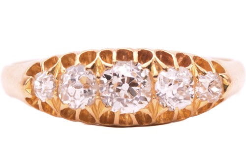 Lot 147 - A diamond ring set with a graduated row of old...