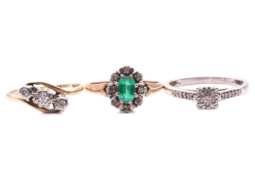 Lot 23 - A diamond three stone cross over ring, with a...