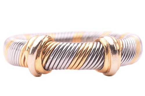 Lot 106 - Cartier - a bi-coloured 'Aurore' ring,...