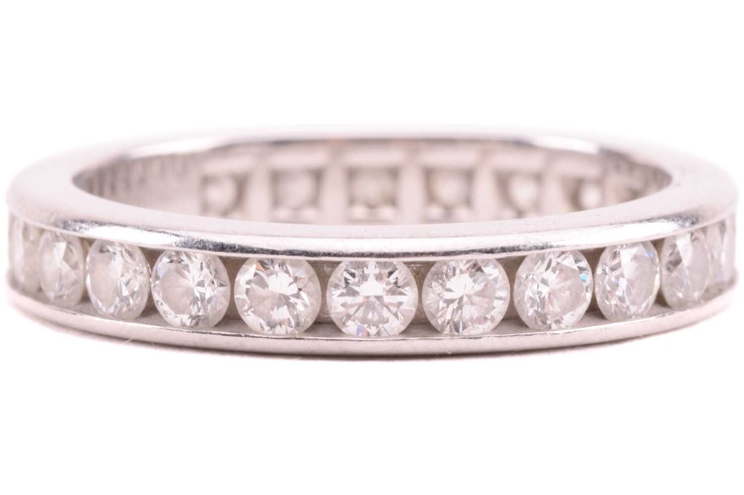 Lot 96 - A Tiffany and Co. diamond eternity ring, set...