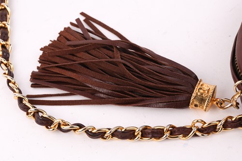 Lot 27 - Chanel - a camera bag in brown quilted...