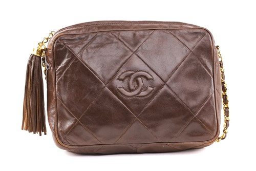 Lot 27 - Chanel - a camera bag in brown quilted...