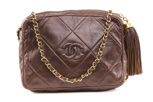 Lot 27 - Chanel - a camera bag in brown quilted...