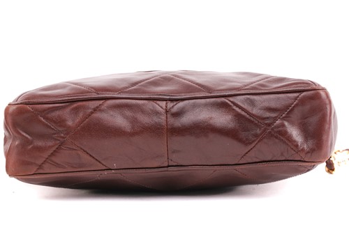 Lot 27 - Chanel - a camera bag in brown quilted...