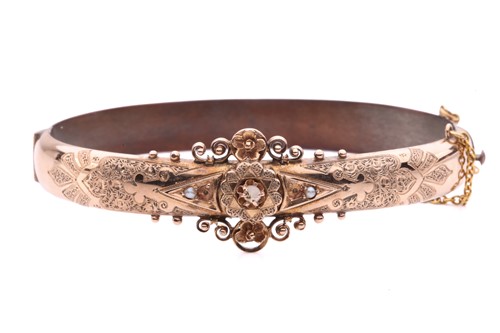 Lot 103 - A Victorian hinged bracelet set with seed...