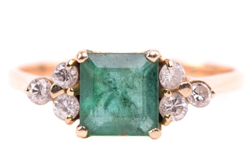 Lot 271 - An emerald and diamond ring, set to the centre...