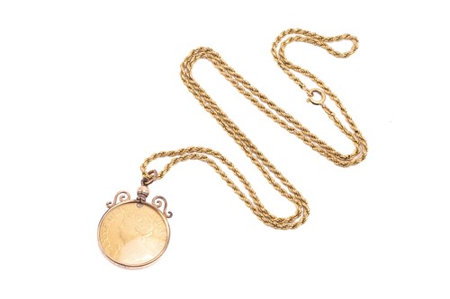 Lot 294 - A Queen Anne gold guinea in mount and an...