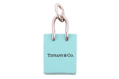 Lot 48 - Tiffany & Co. - a shopping bag charm with...