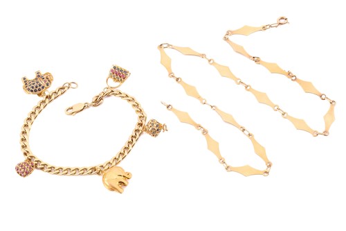 Lot 182 - A yellow metal curb pattern bracelet,...