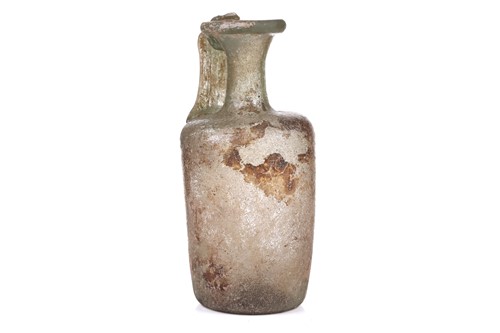 Lot 261 - A Roman glass oil ewer of slightly...