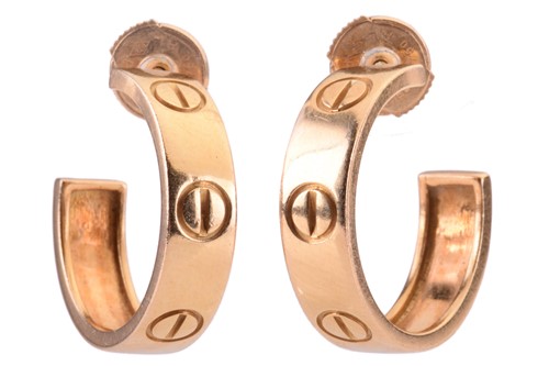 Lot 53 - A pair of Cartier 'Love' earrings, each of...