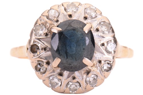 Lot 69 - A sapphire and diamond cluster ring, set to...