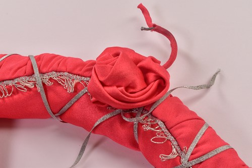 Lot 70 - A bright coral-coloured hooded full-length...