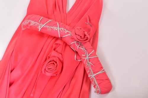 Lot 70 - A bright coral-coloured hooded full-length...